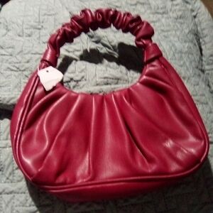 Must haves  NWT smaller burgundy purse.